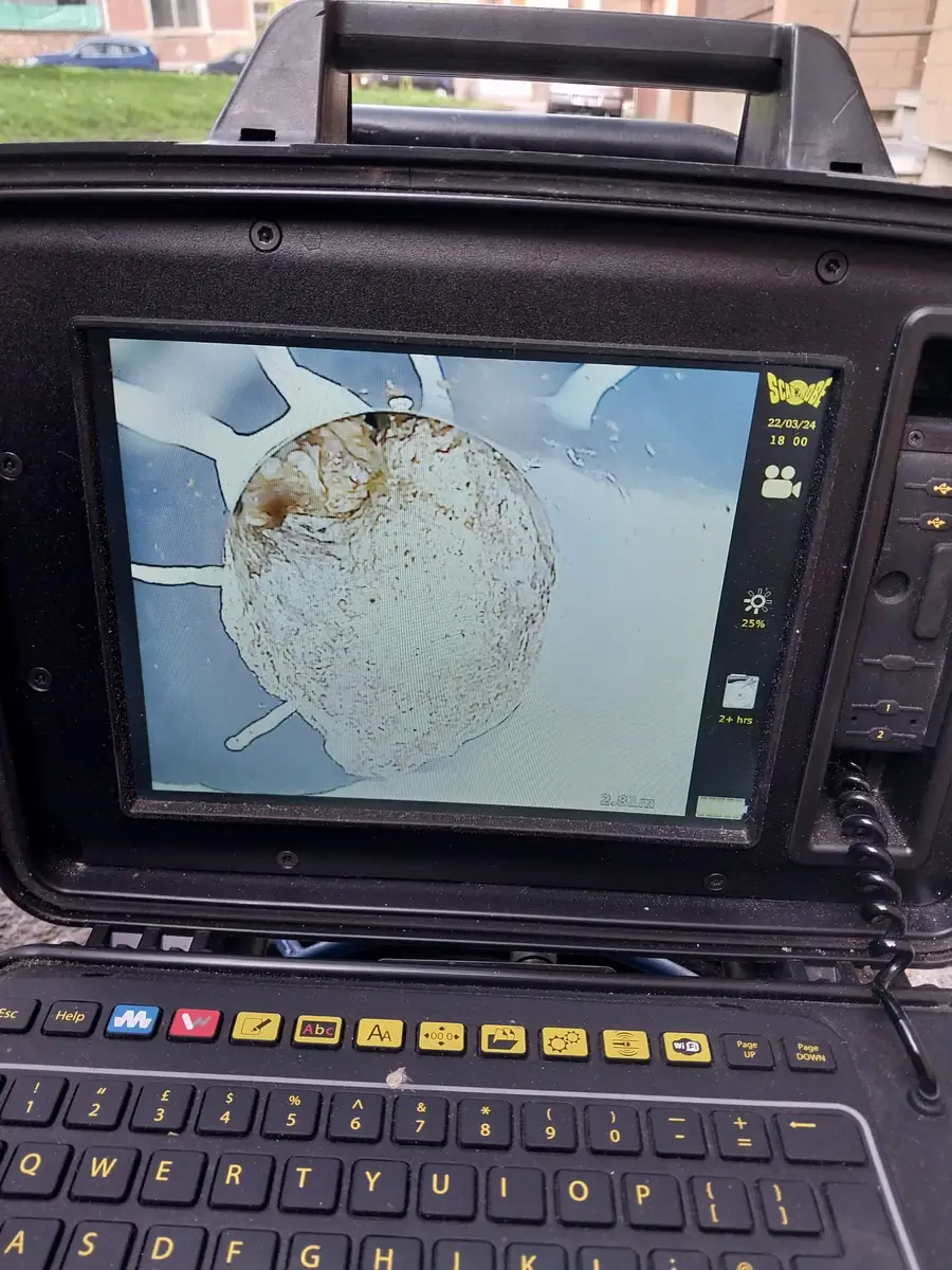 CCTV screen showing a root blockage 2.8 metres inside a sewer pipe