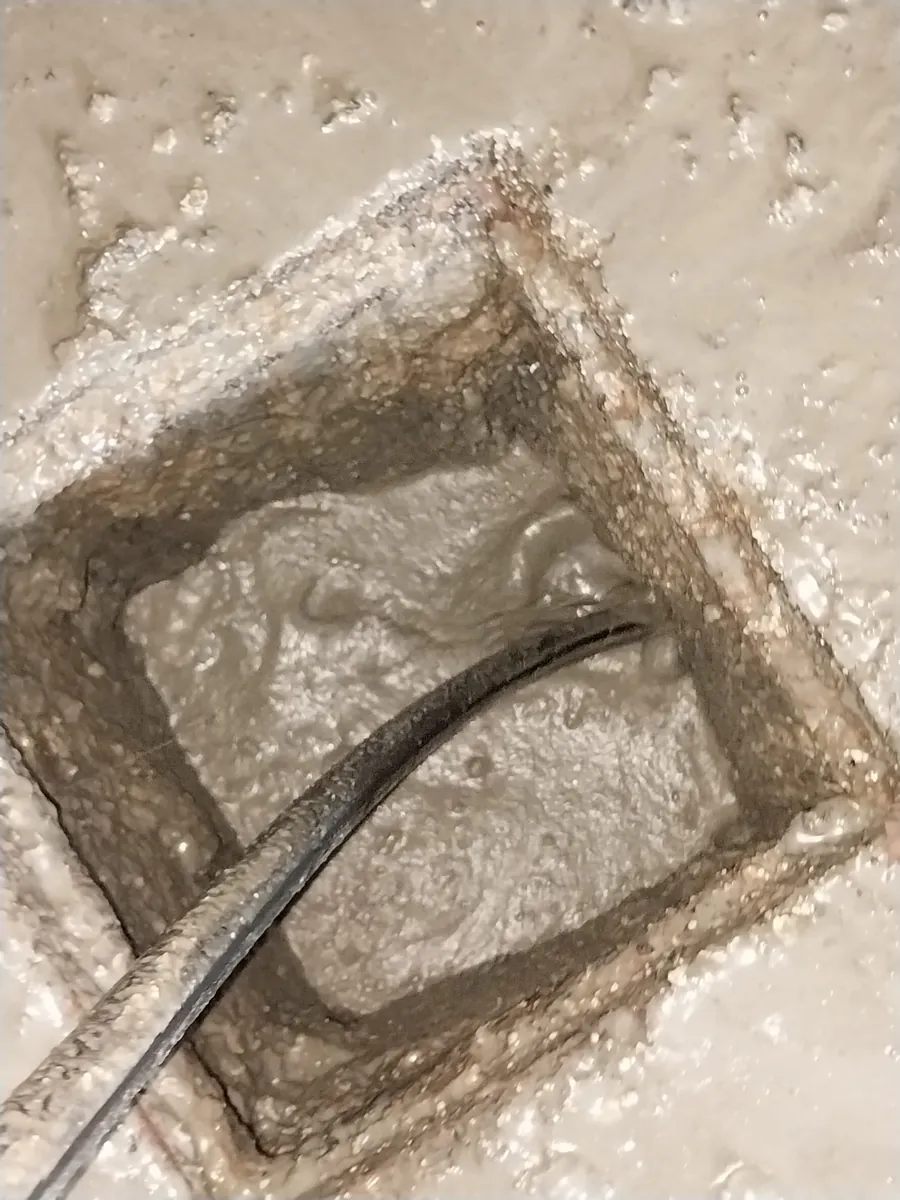 Water running freely through the chamber after high-pressure jetting